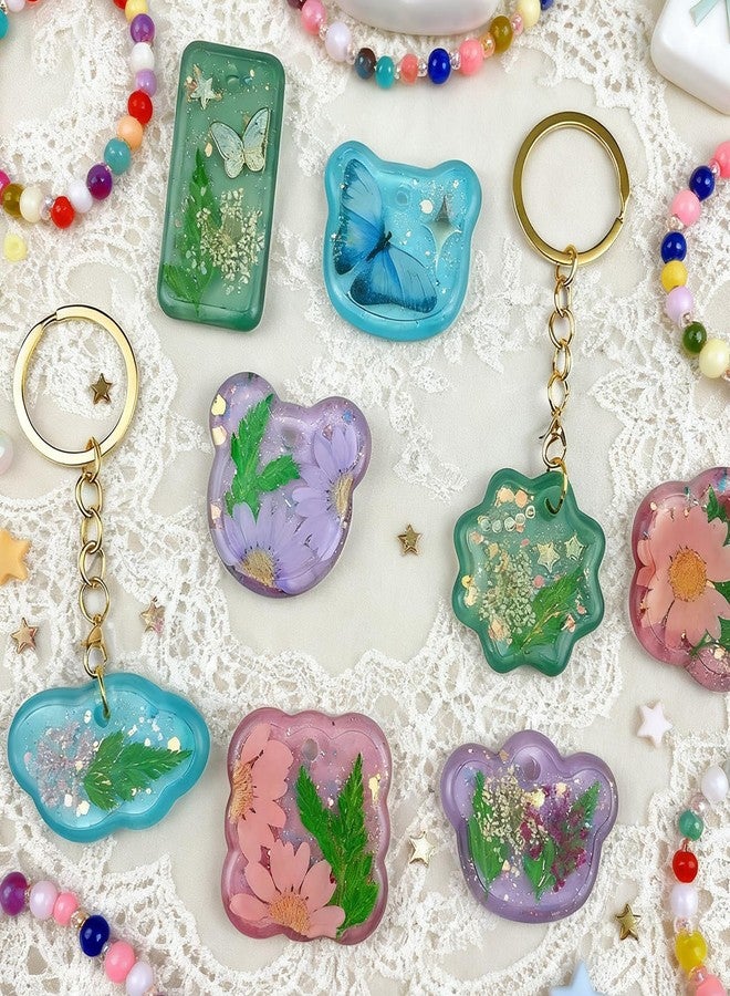 سكويشي مجموعة قوالب مجوهرات من الراتنج مكونة من 16 قطعة، طقم فنون الراتنج مع قوالب، مجموعة قوالب سيليكون لقلادات الإيبوكسي الكريستالية لصنع سلاسل المفاتيح والقلائد والهدايا، تتضمن أشكال المكعب والنجمة والقلب والزهرة والتيجان (أبيض - 2) - Image 2